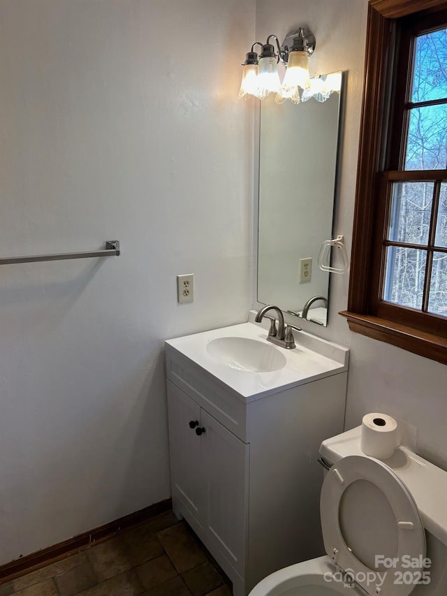 bathroom with vanity and toilet