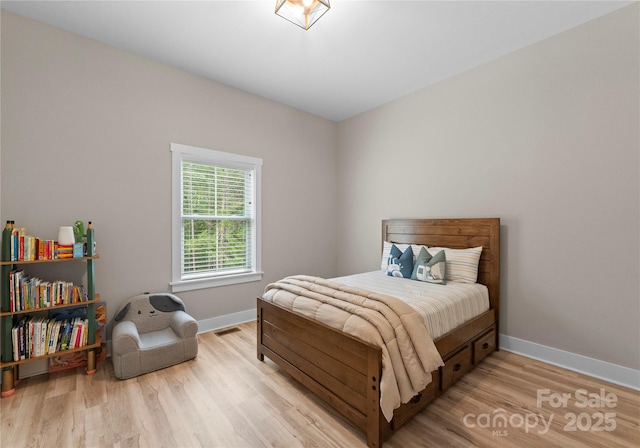 bedroom featuring light wood-type flooring