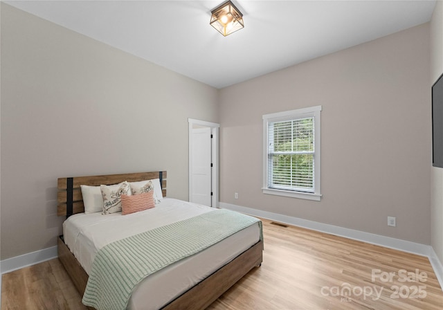 bedroom featuring light hardwood / wood-style floors