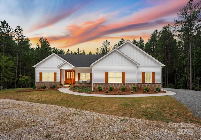 modern inspired farmhouse featuring a lawn and a porch