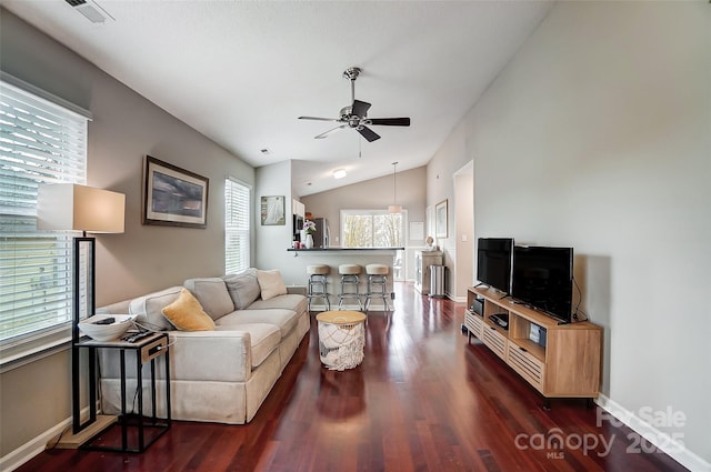 living room featuring ceiling fan, dark hardwood / wood-style flooring, and lofted ceiling