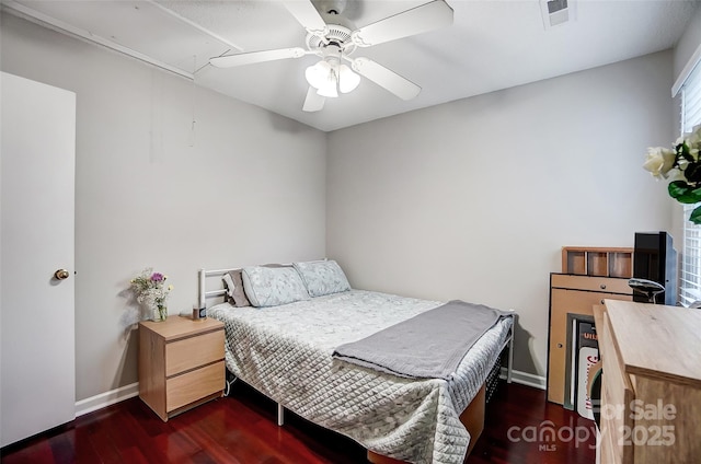 bedroom featuring ceiling fan and dark wood-type flooring