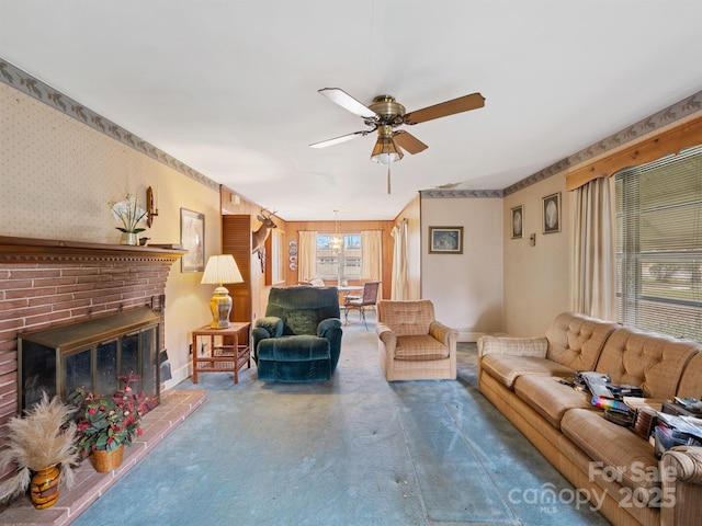 carpeted living room featuring ceiling fan, wooden walls, and a brick fireplace