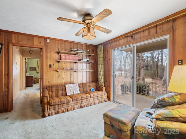 carpeted living room featuring ceiling fan