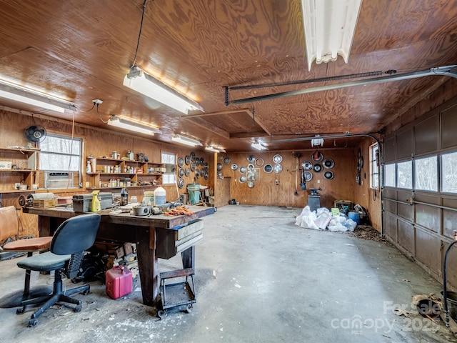 interior space featuring a workshop area, wooden walls, and wood ceiling