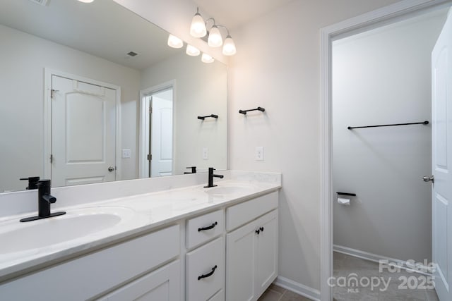 bathroom featuring vanity and tile patterned floors