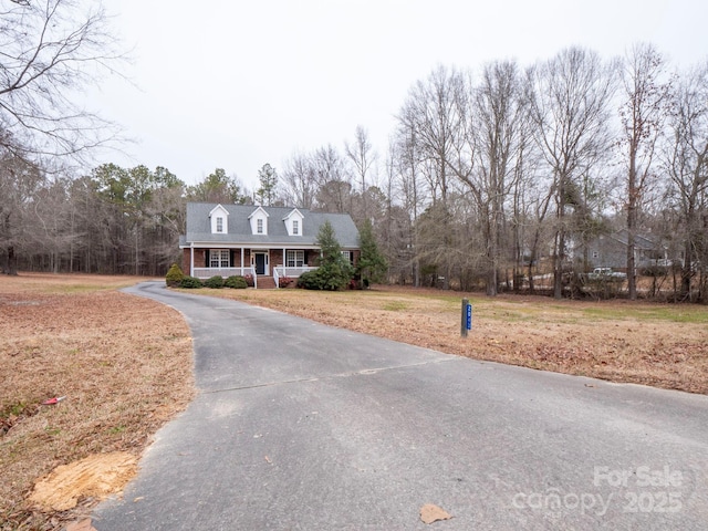 cape cod home with covered porch