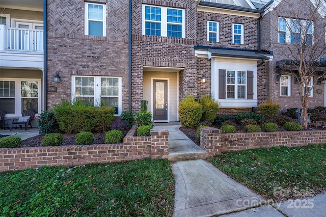 exterior space featuring brick siding