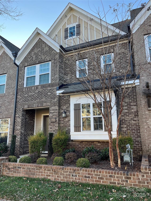 view of front of house with brick siding