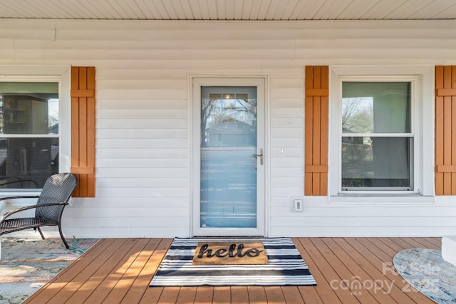 view of exterior entry with covered porch