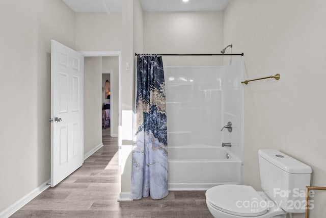 bathroom featuring shower / bath combination with curtain, toilet, and wood-type flooring