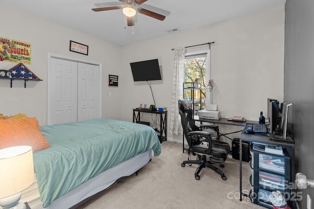 bedroom with carpet flooring, a closet, and ceiling fan