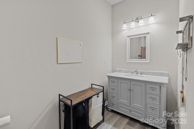 bathroom featuring hardwood / wood-style floors and vanity