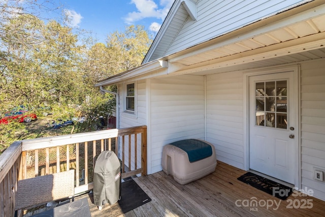 wooden terrace with area for grilling