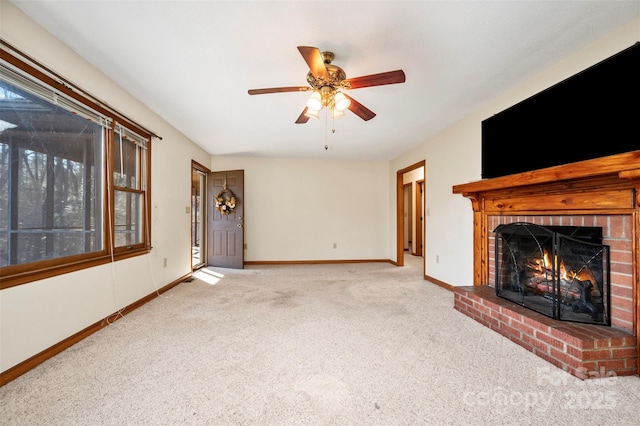 unfurnished living room featuring ceiling fan, light carpet, and a brick fireplace