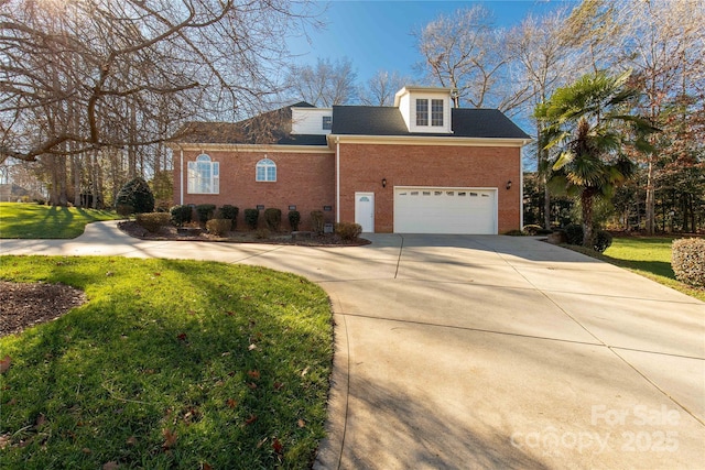 view of front of property with a front yard and a garage