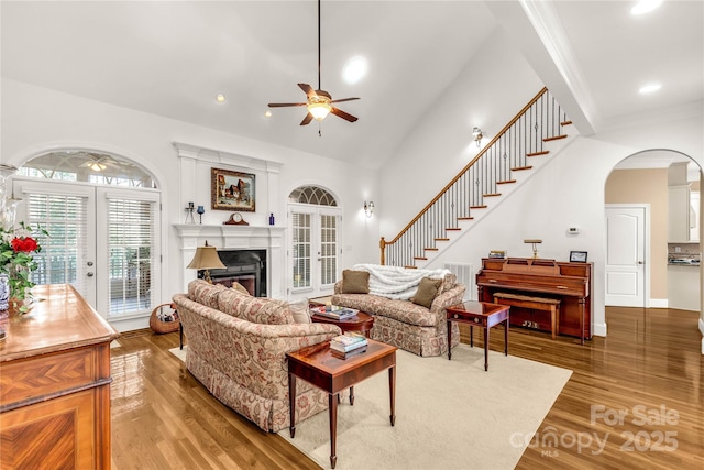 living room featuring french doors, hardwood / wood-style flooring, and ceiling fan