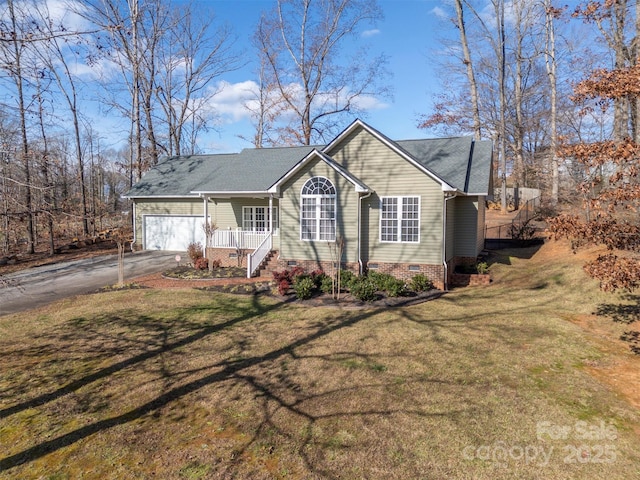 single story home featuring a porch, a garage, and a front lawn