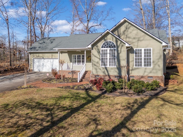 single story home featuring a porch, a garage, and a front yard