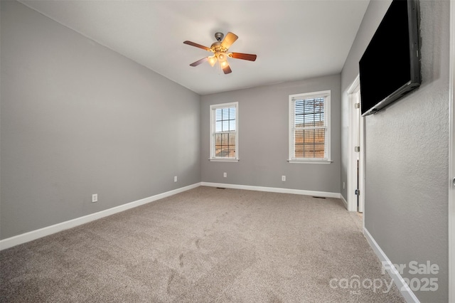 empty room with carpet and ceiling fan