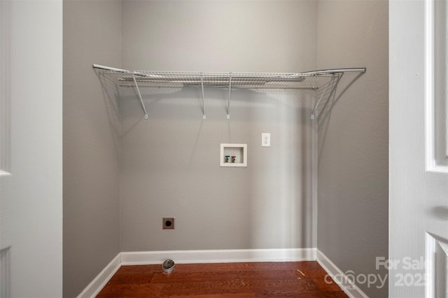 washroom featuring electric dryer hookup, hookup for a washing machine, and hardwood / wood-style floors