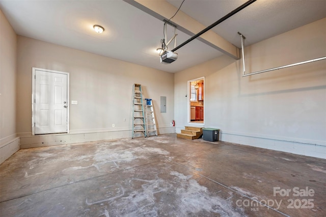 garage featuring electric panel and a garage door opener