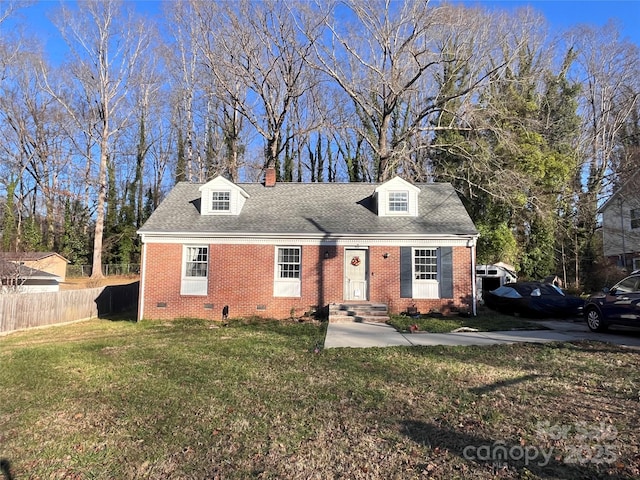 cape cod home with a front lawn