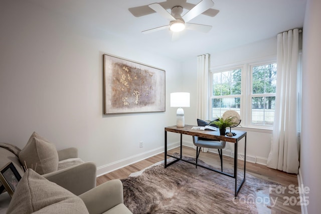 office area with hardwood / wood-style flooring and ceiling fan