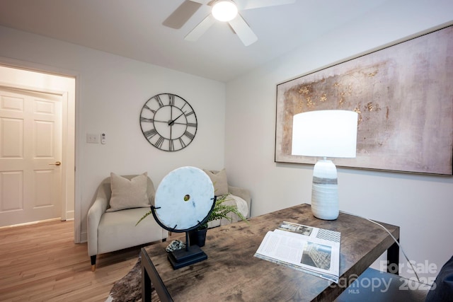 home office with hardwood / wood-style flooring and ceiling fan