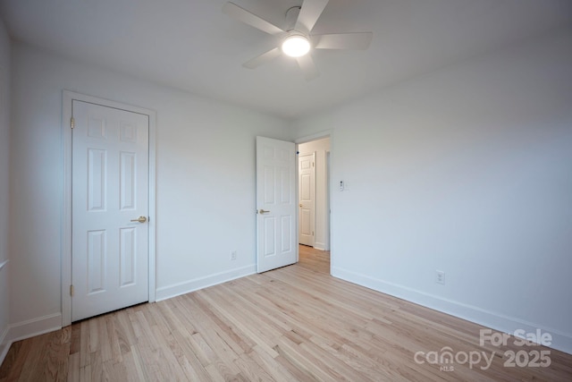 unfurnished bedroom with light hardwood / wood-style floors and ceiling fan