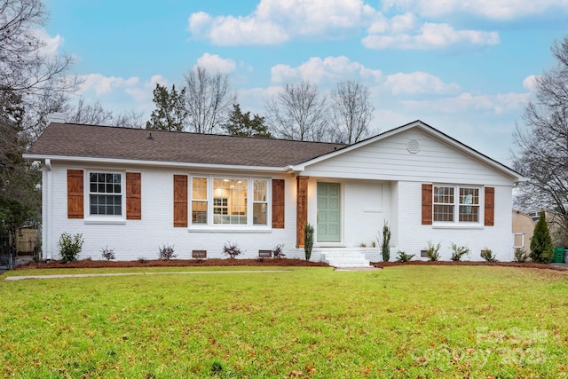 ranch-style home featuring a front yard