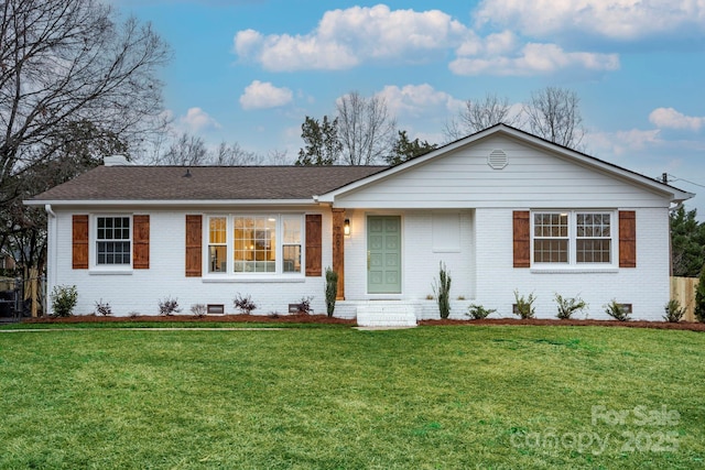 ranch-style home with a front lawn