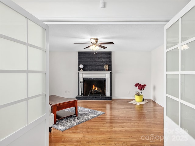 950 Blanton St, Columbus, NC 28722 - unfurnished living room with a brick fireplace, ceiling fan, and light wood finished floors