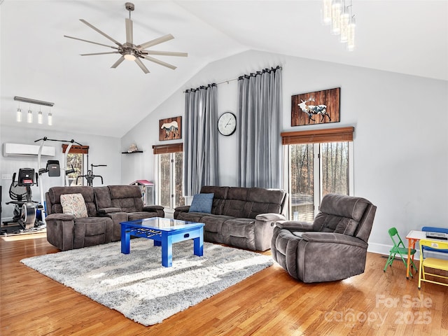 950 Blanton St, Columbus, NC 28722 - living room with an AC wall unit, a ceiling fan, plenty of natural light, high vaulted ceiling, and wood finished floors