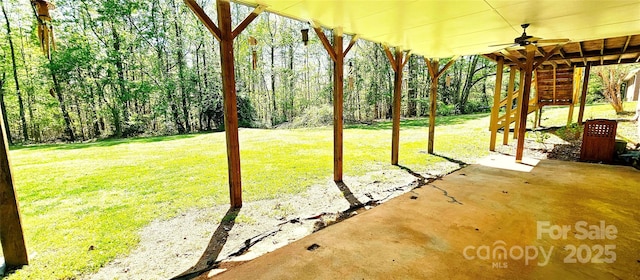 950 Blanton St, Columbus, NC 28722 - view of green lawn featuring a ceiling fan and a patio