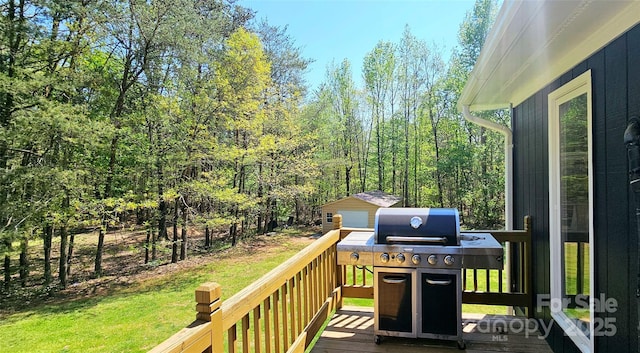 950 Blanton St, Columbus, NC 28722 - deck with grilling area, a lawn, an outdoor structure, and a wooded view