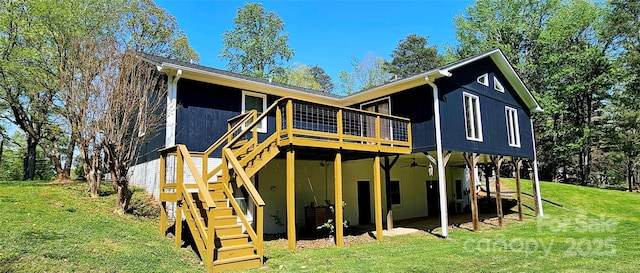 950 Blanton St, Columbus, NC 28722 - back of property with a yard, stairs, a deck, and a ceiling fan