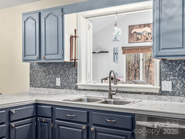 950 Blanton St, Columbus, NC 28722 - kitchen featuring dishwasher, decorative backsplash, light countertops, blue cabinetry, and vaulted ceiling