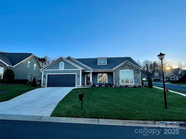 view of front of home featuring a garage and a front lawn