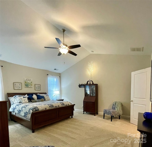 bedroom with light colored carpet, ceiling fan, and lofted ceiling