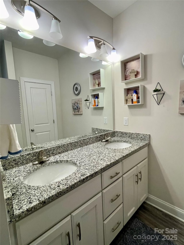 bathroom featuring vanity and wood-type flooring