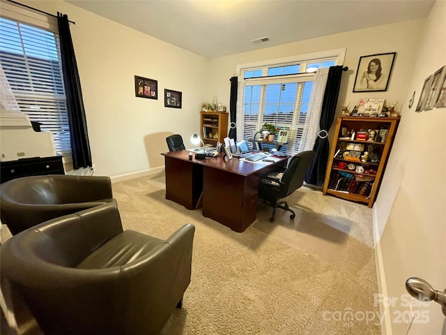 office space with light colored carpet