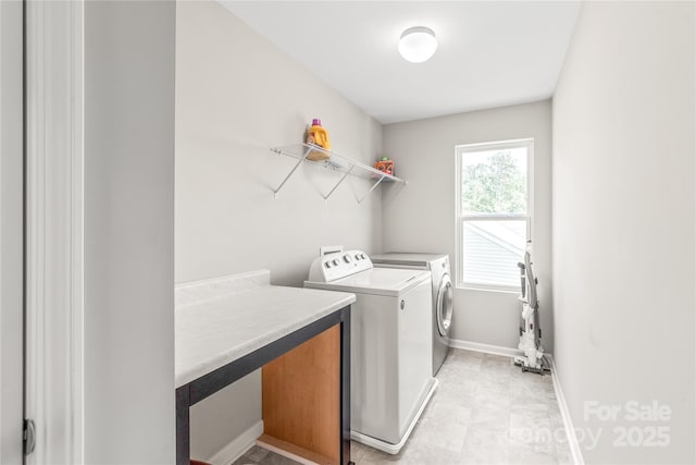 washroom featuring washing machine and clothes dryer