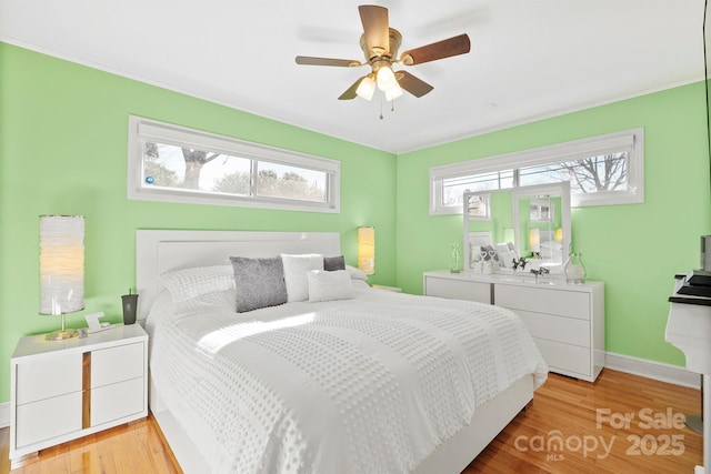 bedroom featuring ceiling fan and light hardwood / wood-style floors