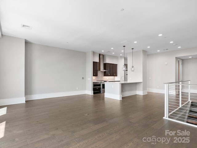 unfurnished living room with dark hardwood / wood-style flooring