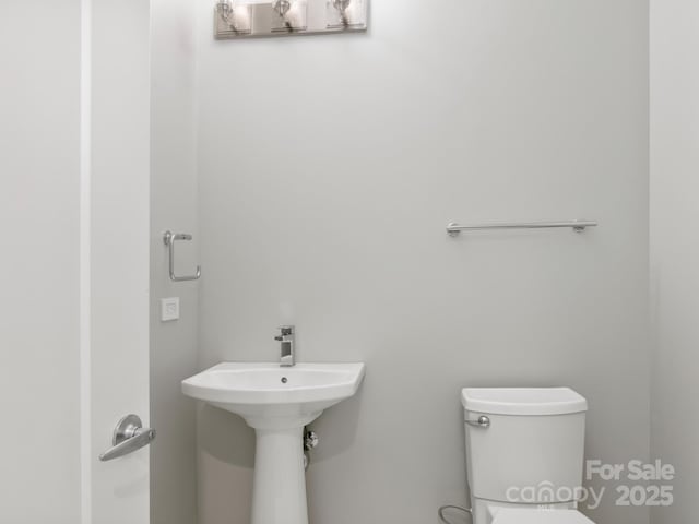 bathroom featuring toilet