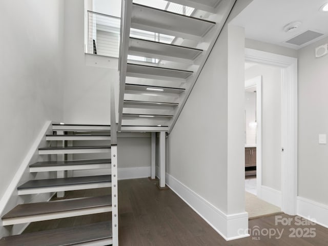 staircase featuring hardwood / wood-style floors