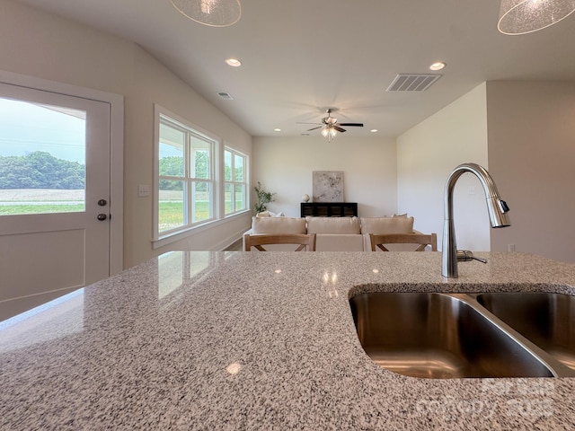46 Griffin Rd Unit 2, Pageland, SC 29728 - kitchen with a sink, light stone counters, recessed lighting, and a ceiling fan