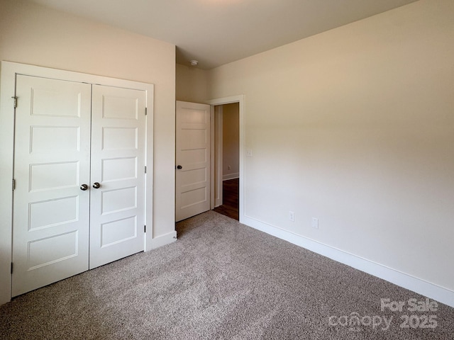 46 Griffin Rd Unit 2, Pageland, SC 29728 - unfurnished bedroom featuring carpet, baseboards, and a closet