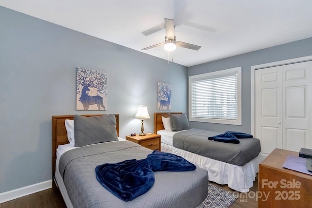 bedroom featuring dark hardwood / wood-style floors, a closet, and ceiling fan